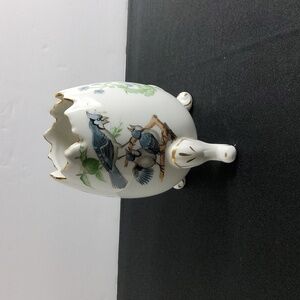 Vintage 3 Footed Egg Vase .